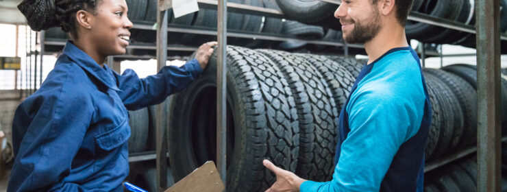 Customer choosing car tire in automobile store
