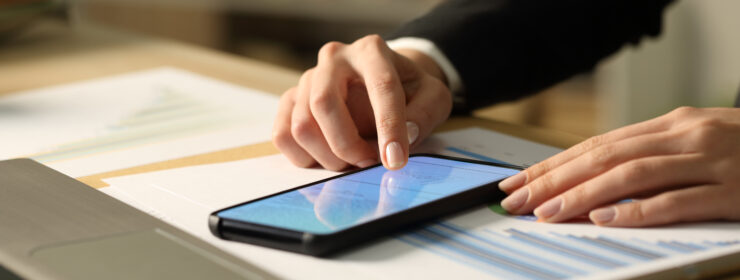 Entrepreneur hands signing contract on phone at night