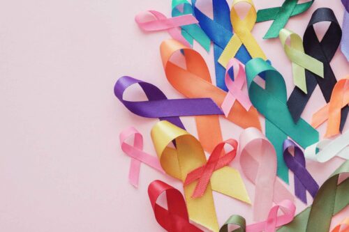 Colorful ribbons on pink background