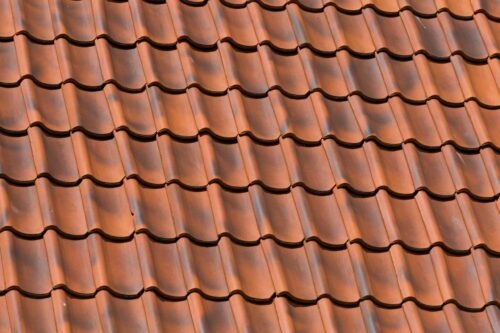 Red tiles roof background texture of a house