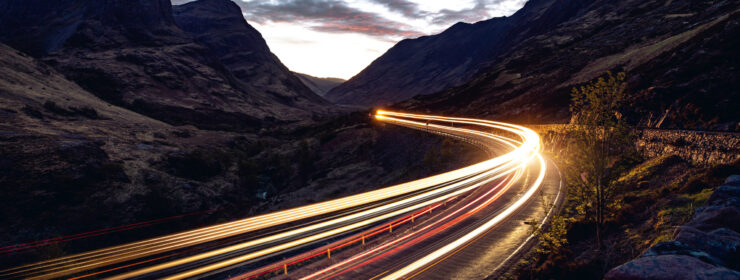 Light trails in the night on a remote road in mountains