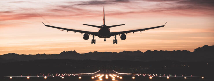 Aircraft landing at sunrise