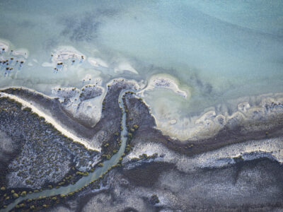 Aerial abstract of beautiful coastline. Spiral wood staircase with eye shape high angle view in natural light