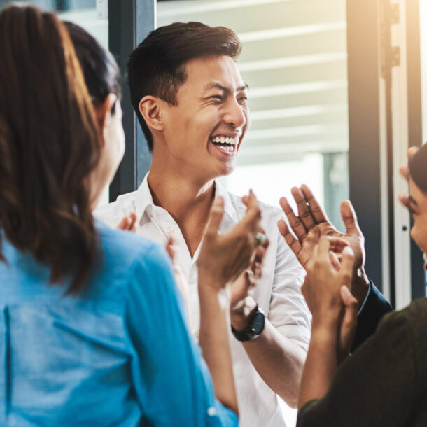 Smiling Colleagues applauding