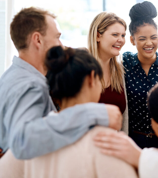 Smiling group embrace